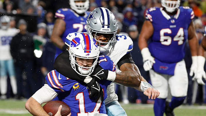 Buffalo Bills quarterback Josh Allen is caught from behind by Dallas Cowboys linebacker Damone Clark 