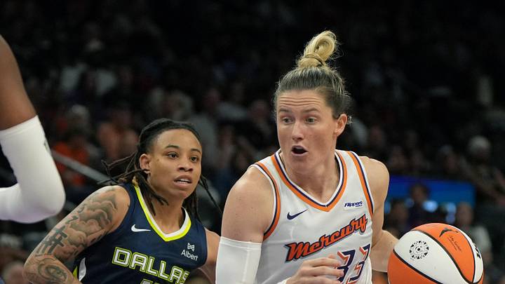Jul 7, 2025; Phoenix, Arizona, USA; Phoenix Mercury guard Sami Whitcomb (33) drives past Dallas Wings guard JJ Quinerly (11) in the second half at Footprint Center. Mandatory Credit: Rick Scuteri-Imagn Images