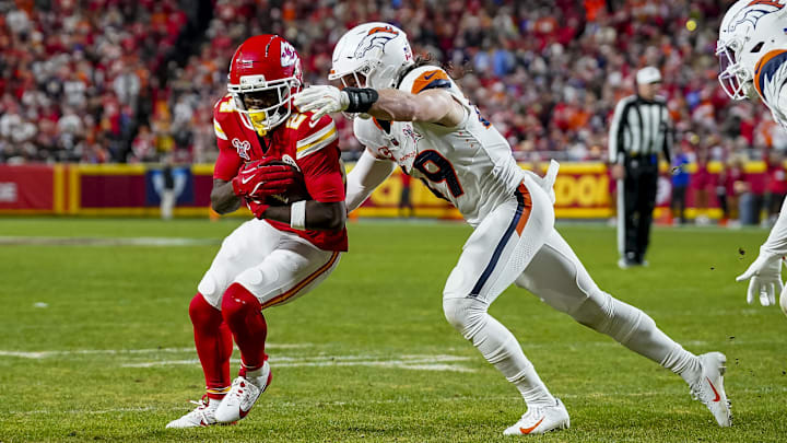 Dec 25, 2025; Kansas City, Missouri, USA; Kansas City Chiefs running back Brashard Smith (24) scores a touchdown attempts to tackle at GEHA Field at Arrowhead Stadium. Mandatory Credit: Denny Medley-Imagn Images