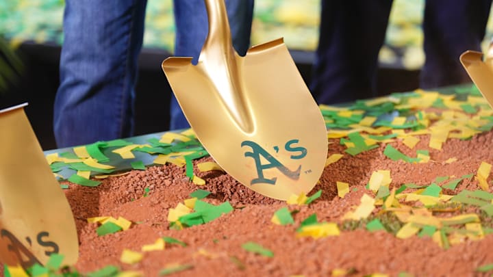 Gold shovel with Athletics on it in the dirt as the team's ceremonial groundbreaking in Las Vegas