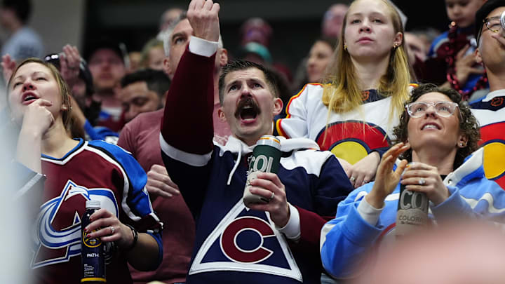 Feb 28, 2026; Denver, Colorado, USA; Colorado Avalanche fans celebrate a goal in the third period against the Chicago Blackhawks at Ball Arena. Mandatory Credit: Ron Chenoy-Imagn Images