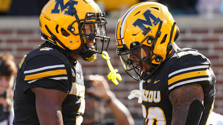 Oct 19, 2024; Columbia, Missouri, USA; Missouri Tigers wide receiver Luther Burden III (3) and running back Jamal Roberts (20) celebrate after a touchdown during the second half against the Auburn Tigers at Faurot Field at Memorial Stadium. Mandatory Credit: Jay Biggerstaff-Imagn Images
