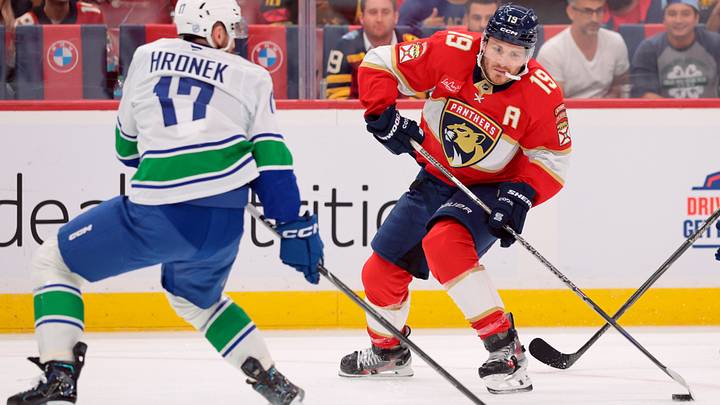 Oct 15, 2026; Sunrise, Florida, USA; Florida Panthers left wing Matthew Tkachuk (19) moves the puck against Vancouver Canucks defenseman Filip Hronek (17) during the second period at Amerant Bank Arena. Mandatory Credit: Sam Navarro-Imagn Images Oct 15, 2026; Sunrise, Florida, USA; Florida Panthers left wing Matthew Tkachuk (19) moves the puck against Vancouver Canucks defenseman Filip Hronek (17) during the second period at Amerant Bank Arena. Mandatory Credit: Sam Navarro-Imagn Images