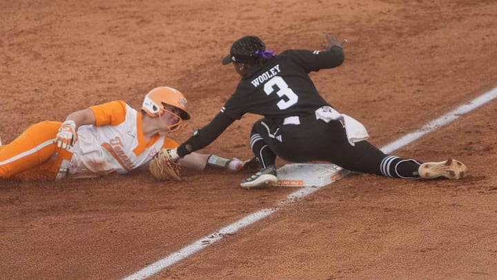 Tennessee utility player Ella Dodge (25) is tagged out at third base by Texas A&M infielder Koko Wooley (3) during a softball game between Tennessee and Texas A&M at Sherri Parker Lee Stadium at University of Tennessee, in Knoxville, Tenn., May 1, 2025. Tennessee utility player Ella Dodge (25) is tagged out at third base by Texas A&M infielder Koko Wooley (3) during a softball game between Tennessee and Texas A&M at Sherri Parker Lee Stadium at University of Tennessee, in Knoxville, Tenn., May 1, 2025.