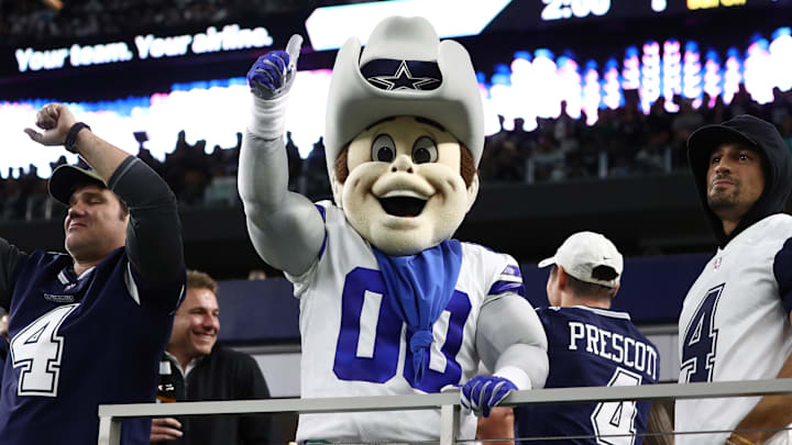 Dallas Cowboys mascot Rowdy cheers with fans during overtime against Philadelphia Eagles. Dallas Cowboys mascot Rowdy cheers with fans during overtime against Philadelphia Eagles.