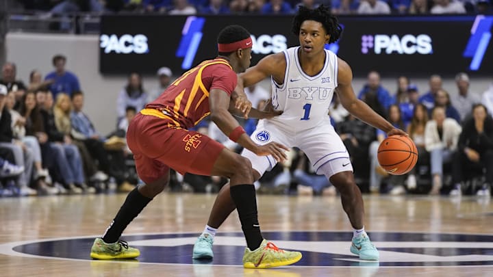 Feb 21, 2026; Provo, Utah, USA; BYU Cougars guard Robert Wright III (1) controls the ball during the first half against the Iowa State Cyclones at Marriott Center. Mandatory Credit: Aaron Baker-Imagn Images