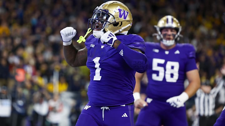 Oct 5, 2024; Seattle, Washington, USA; Washington Huskies running back Jonah Coleman (1) celebrates after rushing for a touchdown against the Michigan Wolverines during the fourth quarter at Alaska Airlines Field at Husky Stadium.