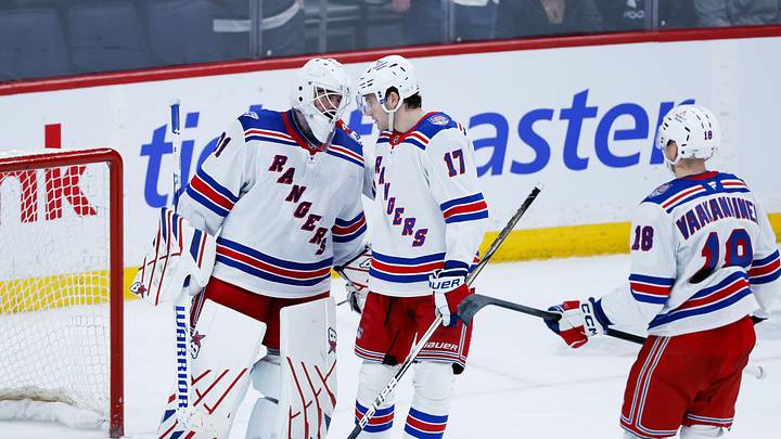 Mar 12, 2026; Winnipeg, Manitoba, CAN; New York Rangers goalie Igor Shesterkin (31) is congratulated by defenseman Will Borgen (17) on his win against the Winnipeg Jets at the end of the third period at Canada Life Centre.