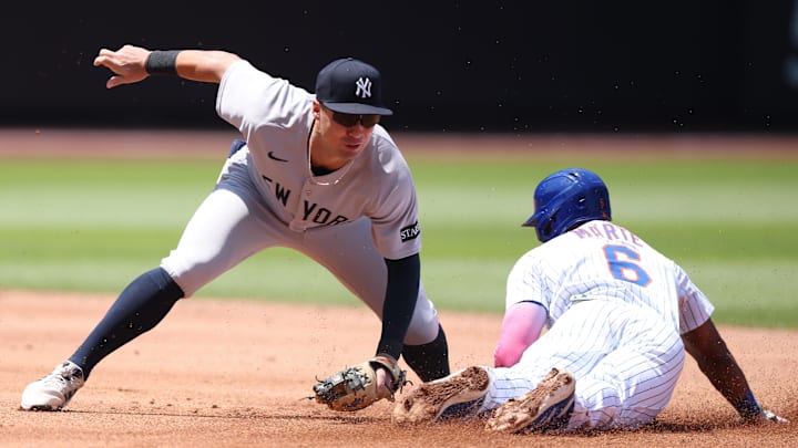 Jul 6, 2025; New York City, New York, USA;New York Mets left fielder Starling Marte (6) beats the tag by New York Yankees shortstop Anthony Volpe (11) at second base during the first inning at Citi Field. Mandatory Credit: Vincent Carchietta-Imagn Images Jul 6, 2025; New York City, New York, USA;New York Mets left fielder Starling Marte (6) beats the tag by New York Yankees shortstop Anthony Volpe (11) at second base during the first inning at Citi Field. Mandatory Credit: Vincent Carchietta-Imagn Images