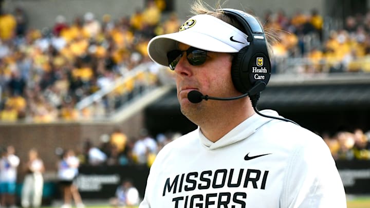 Sep 6, 2025; Columbia, Missouri, USA; Missouri Tigers coach Eli Drinkwitz watches from the sideline in the second half of the Border War against the Kansas Jayhawks at Faurot Field at Memorial Stadium. Sep 6, 2025; Columbia, Missouri, USA; Missouri Tigers coach Eli Drinkwitz watches from the sideline in the second half of the Border War against the Kansas Jayhawks at Faurot Field at Memorial Stadium.