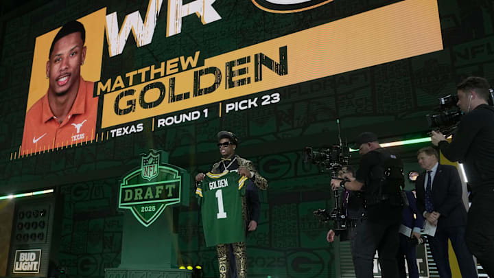 Receiver Matthew Golden of Texas poses after being selected with the 23rd overall pick by the Green Bay Packers. Receiver Matthew Golden of Texas poses after being selected with the 23rd overall pick by the Green Bay Packers.