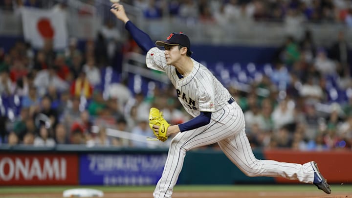 Mar 20, 2023; Miami, Florida, USA; Japan starting pitcher Roki Sasaki (14) delivers a pitch during the first inning against Mexico at LoanDepot Park. Mar 20, 2023; Miami, Florida, USA; Japan starting pitcher Roki Sasaki (14) delivers a pitch during the first inning against Mexico at LoanDepot Park.