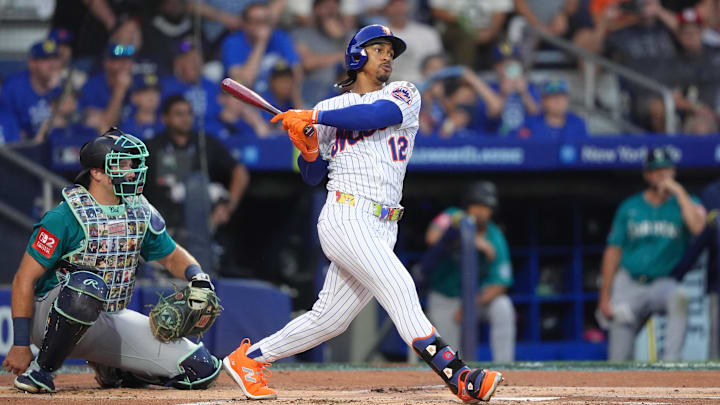 Aug 17, 2025; Williamsport, Pennsylvania, USA; New York Mets infielder Francisco Lindor (12) hits a single against the Seattle Mariners in the first inning at Journey Bank Ballpark at Historic Bowman Field. Mandatory Credit: Kyle Ross-Imagn Images
