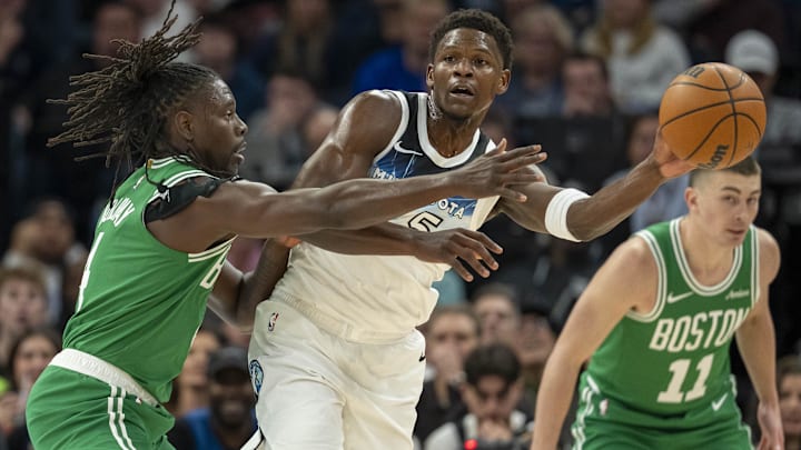Jan 2, 2025; Minneapolis, Minnesota, USA; Minnesota Timberwolves guard Anthony Edwards (5) passes around Boston Celtics guard Jrue Holiday (4) in the first half at Target Center. Mandatory Credit: Jesse Johnson-Imagn Images Jan 2, 2025; Minneapolis, Minnesota, USA; Minnesota Timberwolves guard Anthony Edwards (5) passes around Boston Celtics guard Jrue Holiday (4) in the first half at Target Center. Mandatory Credit: Jesse Johnson-Imagn Images