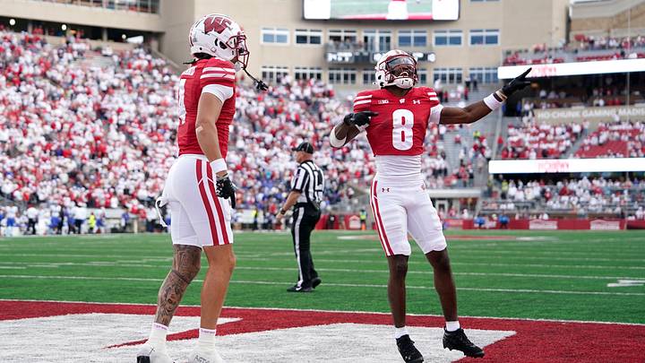 Sep 6, 2025; Madison, Wisconsin, USA; Wisconsin Badgers wide receiver Vinny Anthony II (8) reacts to a touchdown by Wisconsin Badgers wide receiver Jayden Ballard, left, during the second half at Camp Randall Stadium. Mandatory Credit: Kayla Wolf-Imagn Images