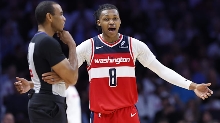 Apr 13, 2025; Miami, Florida, USA; Washington Wizards guard Bub Carrington (8) argues with an official against the Miami Heat during the second half at Kaseya Center. Mandatory Credit: Rhona Wise-Imagn Images