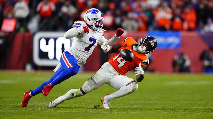Jan 17, 2026; Denver, CO, USA; Buffalo Bills cornerback Taron Johnson (7) is called for pass interference on Denver Broncos wide receiver Courtland Sutton (14) during overtime of an AFC Divisional Round playoff game at Empower Field at Mile High. Mandatory Credit: Ron Chenoy-Imagn Images