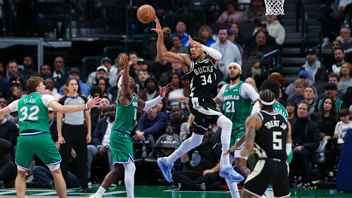 Nov 10, 2025; Dallas, Texas, USA: Milwaukee Bucks forward Giannis Antetokounmpo (34) passes the ball over Dallas Mavericks guard Brandon Williams (10) during the fourth quarter at American Airlines Center. Mandatory Credit: Kevin Jairaj-Imagn Images