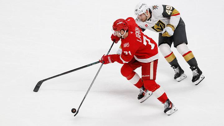 Mar 4, 2026; Detroit, Michigan, USA; Detroit Red Wings center Dylan Larkin (71) skates with the puck chased by Vegas Golden Knights left wing Ivan Barbashev (49) in the first period at Little Caesars Arena. Mandatory Credit: Rick Osentoski-Imagn Images Mar 4, 2026; Detroit, Michigan, USA; Detroit Red Wings center Dylan Larkin (71) skates with the puck chased by Vegas Golden Knights left wing Ivan Barbashev (49) in the first period at Little Caesars Arena. Mandatory Credit: Rick Osentoski-Imagn Images
