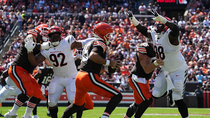 Bengals T.J. Slaton Jr. (98) charges Browns Joe Flocco (15) during their games against the Cleveland Browns at Huntington Bank Field on Sunday September 7, 2025. Bengals lead the game at halftime with a score of 14-10.