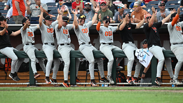 Jun 17, 2025; Omaha, Neb, USA;  The Oregon State Beavers bench cheer action against the Louisville Cardinals during the eighth inning at Charles Schwab Field. Mandatory Credit: Steven Branscombe-Imagn Images