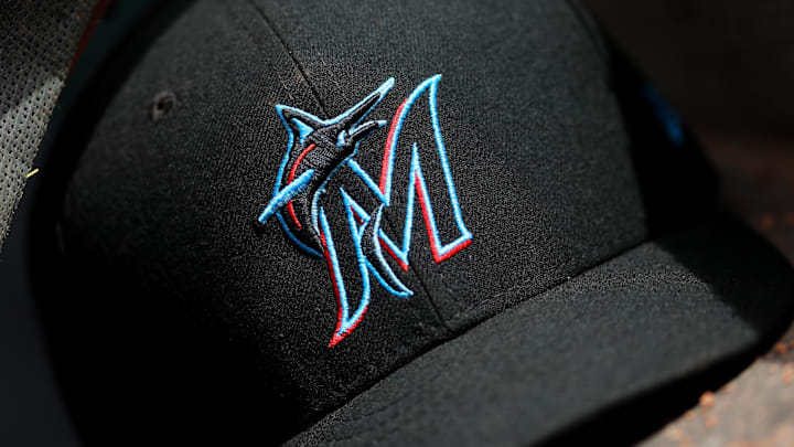 Apr 11, 2019; Cincinnati, OH, USA; A view of a New Era Miami Marlins hat in the dugout during the game against the Cincinnati Reds at Great American Ball Park. Mandatory Credit: Aaron Doster-Imagn Images