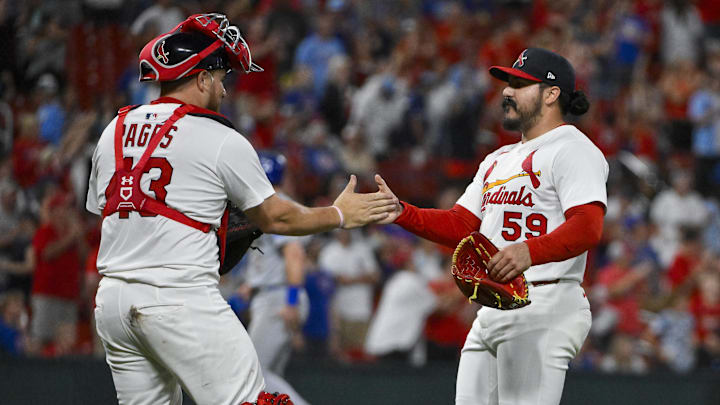 Aug 10, 2025; St. Louis, Missouri, USA;  St. Louis Cardinals relief pitcher JoJo Romero (59) celebrates with catcher Pedro Pages (43) after the Cardinals defeated the Chicago Cubs at Busch Stadium. Mandatory Credit: Jeff Curry-Imagn Images