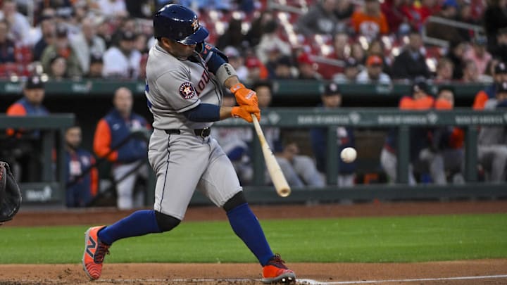 Apr 15, 2025; St. Louis, Missouri, USA; Houston Astros designated hitter Jose Altuve (27) hits a double against the St. Louis Cardinals during the third inning at Busch Stadium. Apr 15, 2025; St. Louis, Missouri, USA; Houston Astros designated hitter Jose Altuve (27) hits a double against the St. Louis Cardinals during the third inning at Busch Stadium.
