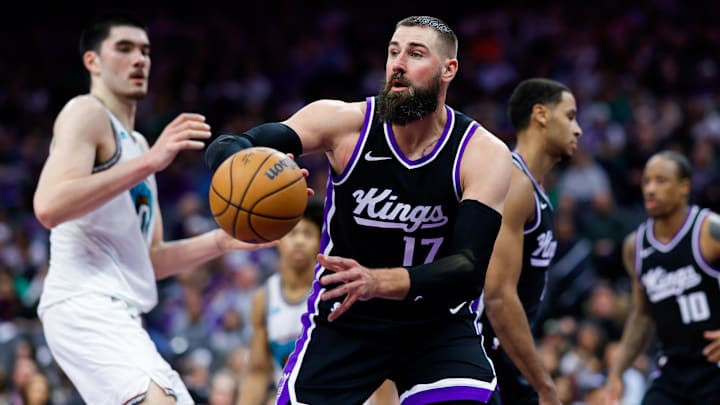 Mar 17, 2025; Sacramento, California, USA; Sacramento Kings center Jonas Valanciunas (17) passes the ball against Memphis Grizzlies center Zach Edey (14) during the fourth quarter at Golden 1 Center. Mandatory Credit: Sergio Estrada-Imagn Images