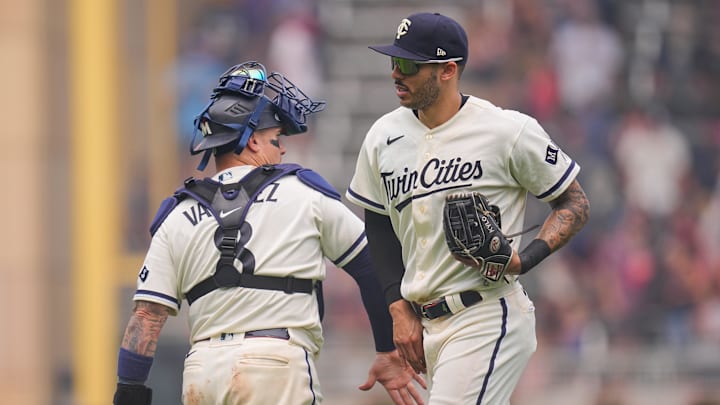 Jun 14, 2023; Minneapolis, Minnesota, USA; Minnesota Twins catcher Christian Vazquez (8) and shortstop Carlos Correa (4) celebrate after the game against the Milwaukee Brewers at Target Field. Mandatory Credit: Brad Rempel-Imagn Images