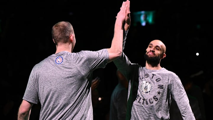 Dec 4, 2024; Boston, Massachusetts, USA; Boston Celtics guard Derrick White (9) high-fives forward Sam Hauser (30) before a game against the Detroit Pistons at the TD Garden. Mandatory Credit: Brian Fluharty-Imagn Images