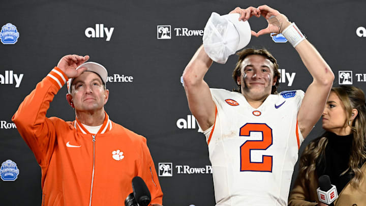 Dec 7, 2024; Charlotte, NC, USA; Clemson Tigers head coach Dabo Swinney, and quarterback Cade Klubnik (2) celebrate after winning the 2024 ACC Championship game against the Southern Methodist Mustangs at Bank of America Stadium. Mandatory Credit: Bob Donnan-Imagn Images Dec 7, 2024; Charlotte, NC, USA; Clemson Tigers head coach Dabo Swinney, and quarterback Cade Klubnik (2) celebrate after winning the 2024 ACC Championship game against the Southern Methodist Mustangs at Bank of America Stadium. Mandatory Credit: Bob Donnan-Imagn Images