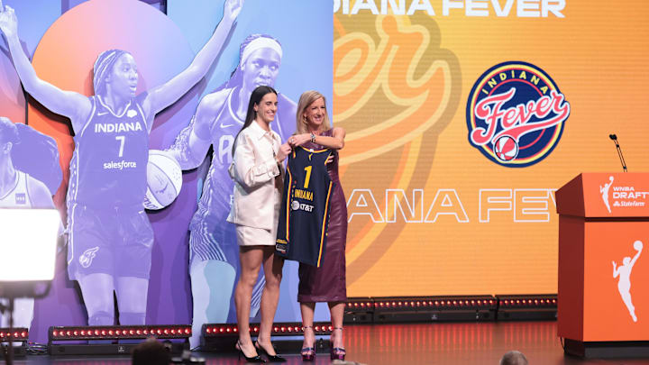 Apr 15, 2024; Brooklyn, NY, USA; Caitlin Clark poses with WNBA commissioner Cathy Engelbert after