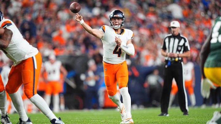 Denver Broncos quarterback Zach Wilson (4) passes the ball in the second half against the Green Bay Packers at Empower Field at Mile High. Ron Chenoy-Imagn Images. Denver Broncos quarterback Zach Wilson (4) passes the ball in the second half against the Green Bay Packers at Empower Field at Mile High. Ron Chenoy-Imagn Images.