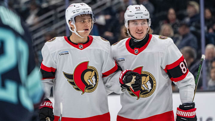 Dec 17, 2024; Seattle, Washington, USA; Ottawa Senators forward Tim Stützle (18) is congratulated by forward Adam Gaudette (81) after scoring a goald during the third period against the Seattle Kraken at Climate Pledge Arena. Mandatory Credit: Stephen Brashear-Imagn Images Dec 17, 2024; Seattle, Washington, USA; Ottawa Senators forward Tim Stützle (18) is congratulated by forward Adam Gaudette (81) after scoring a goald during the third period against the Seattle Kraken at Climate Pledge Arena. Mandatory Credit: Stephen Brashear-Imagn Images