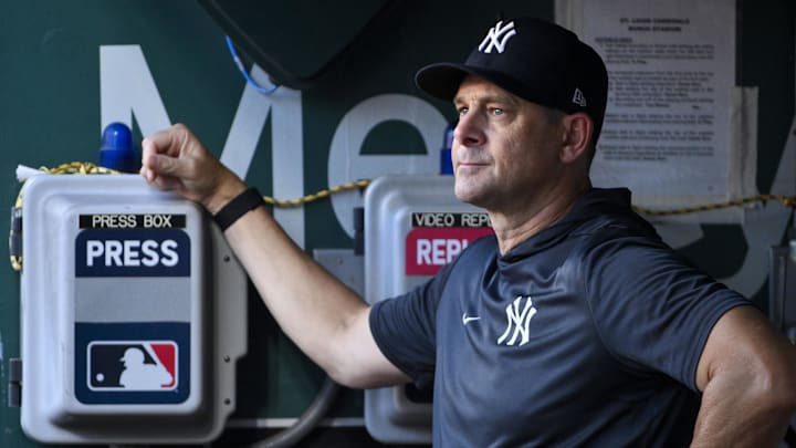 Aug 15, 2025; St. Louis, Missouri, USA;  New York Yankees manager Aaron Boone (17) looks on from the dugout before a game against the St. Louis Cardinals at Busch Stadium. Mandatory Credit: Jeff Curry-Imagn Images