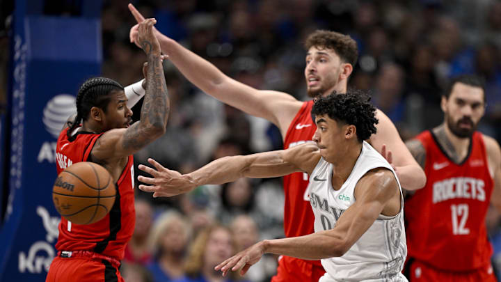 Feb 8, 2025; Dallas, Texas, USA; Dallas Mavericks guard Max Christie (00) passes the ball by Houston Rockets center Alperen Sengun (28) and guard Jalen Green (4) during the second half at the American Airlines Center. Mandatory Credit: Jerome Miron-Imagn Images Feb 8, 2025; Dallas, Texas, USA; Dallas Mavericks guard Max Christie (00) passes the ball by Houston Rockets center Alperen Sengun (28) and guard Jalen Green (4) during the second half at the American Airlines Center. Mandatory Credit: Jerome Miron-Imagn Images