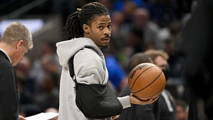 Jan 9, 2024; Dallas, Texas, USA; Memphis Grizzlies guard Ja Morant (12) looks on while wearing his