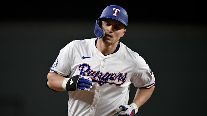 Jul 2, 2025; Arlington, Texas, USA; Texas Rangers shortstop Corey Seager (5) rounds the bases after he hits a home run against the Baltimore Orioles during the fifth inning at Globe Life Field. Mandatory Credit: Jerome Miron-Imagn Images