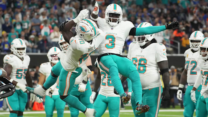 Miami Dolphins wide receiver Tyreek Hill (10) celebrates with wide receiver Odell Beckham Jr. (3) after scoring on a 1-yard touchdown reception against the Los Angeles Rams in the second half at SoFi Stadium.