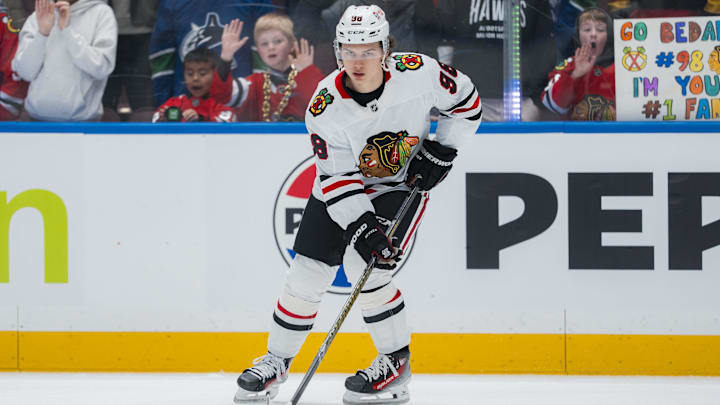 Mar 15, 2025; Vancouver, British Columbia, CAN; Chicago Blackhawks forward Connor Bedard (98) handles the puck  during warm up prior to a game against the Vancouver Canucks at Rogers Arena. Mandatory Credit: Bob Frid-Imagn Images