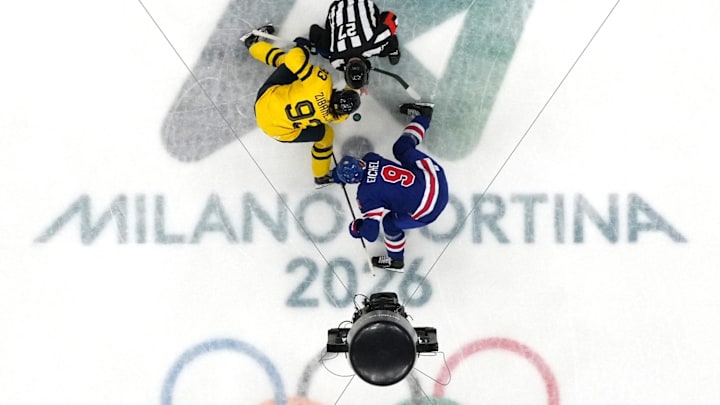 [US, Mexico & Canada customers only] Feb 18, 2026; Milan, Italy; Jack Eichel of United States in action with Mika Zibanejad of Sweden during the opening face off in a men's ice hockey quarterfinal during the Milano Cortina 2026 Olympic Winter Games at Milano Santagiulia Ice Hockey Arena. Mandatory Credit: Marton Monus/Reuters via Imagn Images