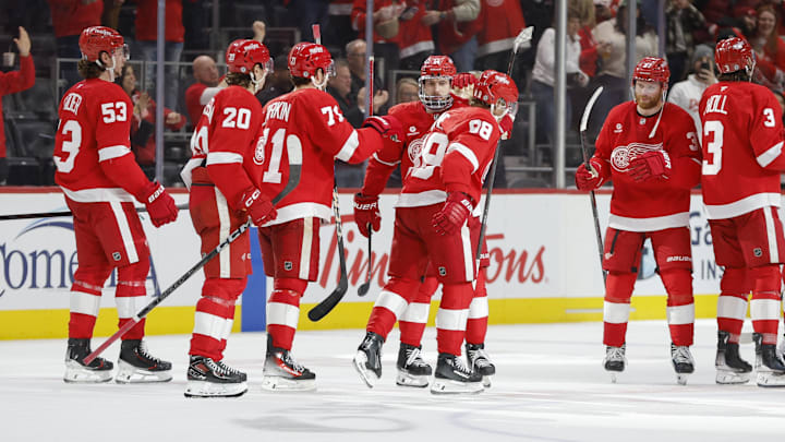 Feb 23, 2025; Detroit, Michigan, USA; The Detroit Red Wings celebrate their win over the Anaheim Ducks at the end of an overtime period at Little Caesars Arena. Mandatory Credit: Brian Bradshaw Sevald-Imagn Images