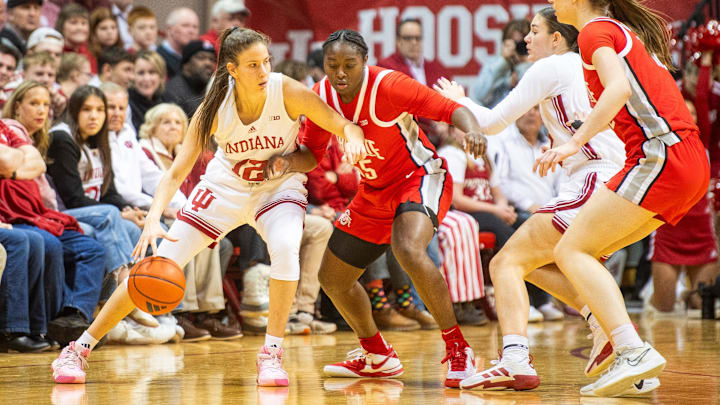 Indiana's Yarden Garzon (12) works against Ohio State's Eboni Walker (55) during the Indiana versus Ohio State womens basketball game at Simon Skjodt Assembly Hall on Thursday, Feb. 20, 2025. Indiana's Yarden Garzon (12) works against Ohio State's Eboni Walker (55) during the Indiana versus Ohio State womens basketball game at Simon Skjodt Assembly Hall on Thursday, Feb. 20, 2025.