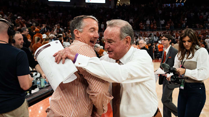 Texas Longhorns head coach Vic Schaefer embraces University of Texas President Jay Hartzell after Texas beat the South Carolina Gamecocks 66-62 at home in Austin at the Moody Center, Feb. 9, 2025.