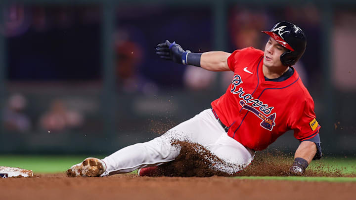 Jun 27, 2025; Atlanta, Georgia, USA; Atlanta Braves right fielder Stuart Fairchild (17) slides in safely with a double against the Philadelphia Phillies in the fifth inning at Truist Park. Mandatory Credit: Brett Davis-Imagn Images