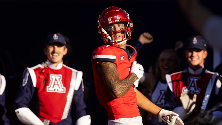 Nov 30, 2024; Tucson, Arizona, USA; Arizona Wildcats wide receiver Tetairoa McMillan (4) celebrates a touchdown against the Arizona State Sun Devils in the second half during the Territorial Cup at Arizona Stadium. Mandatory Credit: Mark J. Rebilas-Imagn Images Nov 30, 2024; Tucson, Arizona, USA; Arizona Wildcats wide receiver Tetairoa McMillan (4) celebrates a touchdown against the Arizona State Sun Devils in the second half during the Territorial Cup at Arizona Stadium. Mandatory Credit: Mark J. Rebilas-Imagn Images