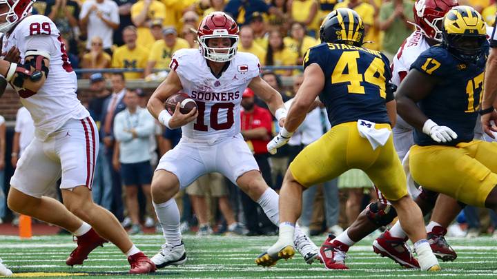 Oklahoma quarterback John Mateer rushes the ball in the first half against the Michigan Wolverines.