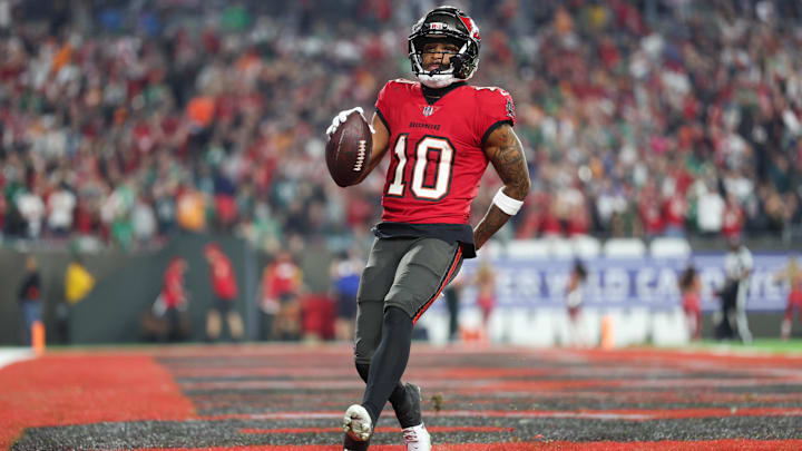 Jan 15, 2024; Tampa, Florida, USA; Tampa Bay Buccaneers wide receiver Trey Palmer (10) runs in a touchdown after a reception against the Philadelphia Eagles during the second half of a 2024 NFC wild card game at Raymond James Stadium. Mandatory Credit: Nathan Ray Seebeck-Imagn Images