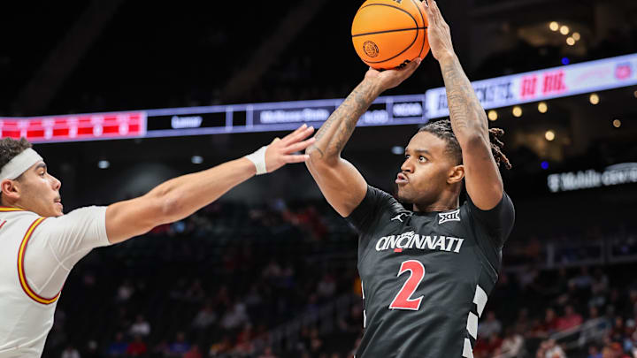 Mar 12, 2025; Kansas City, MO, USA; Cincinnati Bearcats guard Jizzle James (2) shoots the ball during the second half against the Iowa State Cyclones at T-Mobile Center. Mandatory Credit: William Purnell-Imagn Images